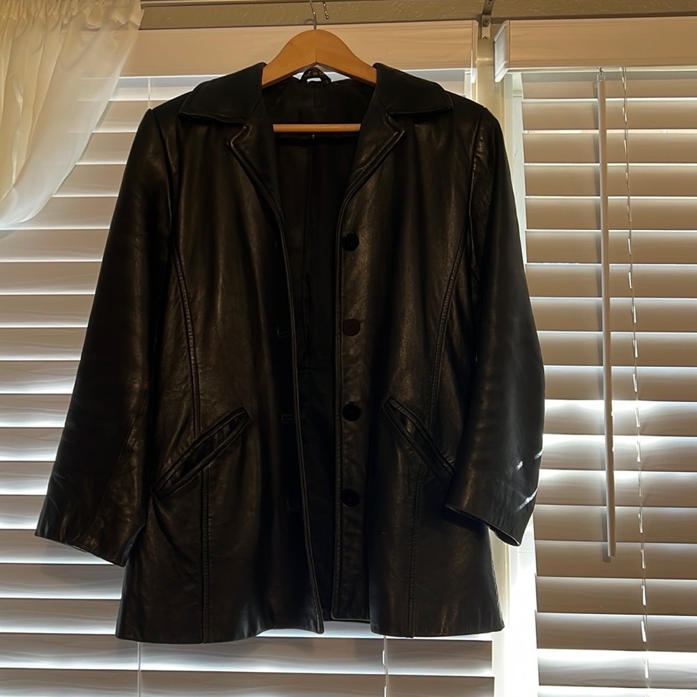 Vintage retro black leather jacket by anonymous